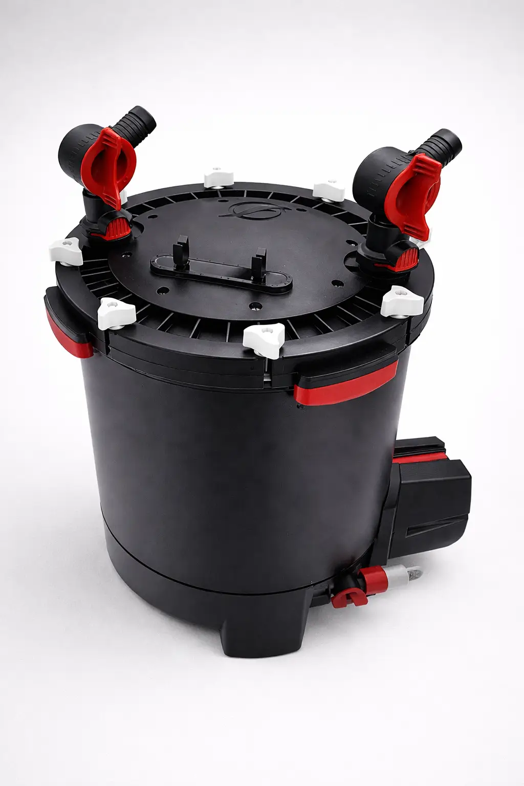 Black cylindrical canister-shaped device with red fittings on a light background
