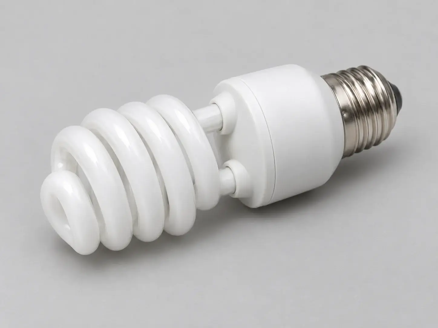 Illustration of an unbranded white coiled compact fluorescent lamp with a screw fitting