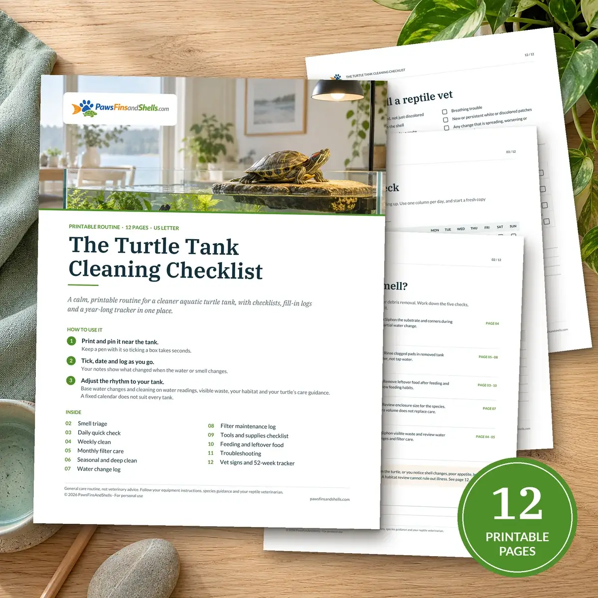 The Turtle Tank Cleaning Checklist, 12 printable pages, shown on a desk